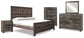 Wynnlow King Crossbuck Panel Bed with Mirrored Dresser, Chest and Nightstand